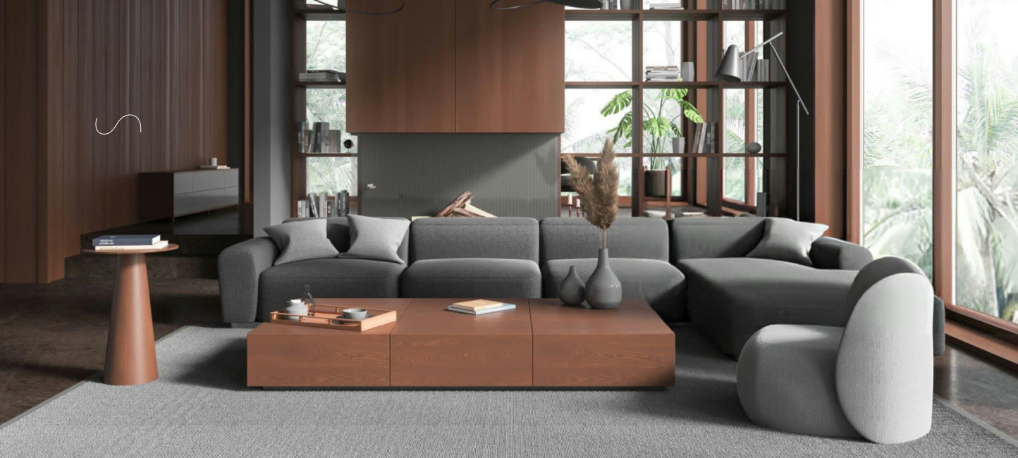 A grey modular sectional sofa and low wooden coffee table in a warm timber-lined room